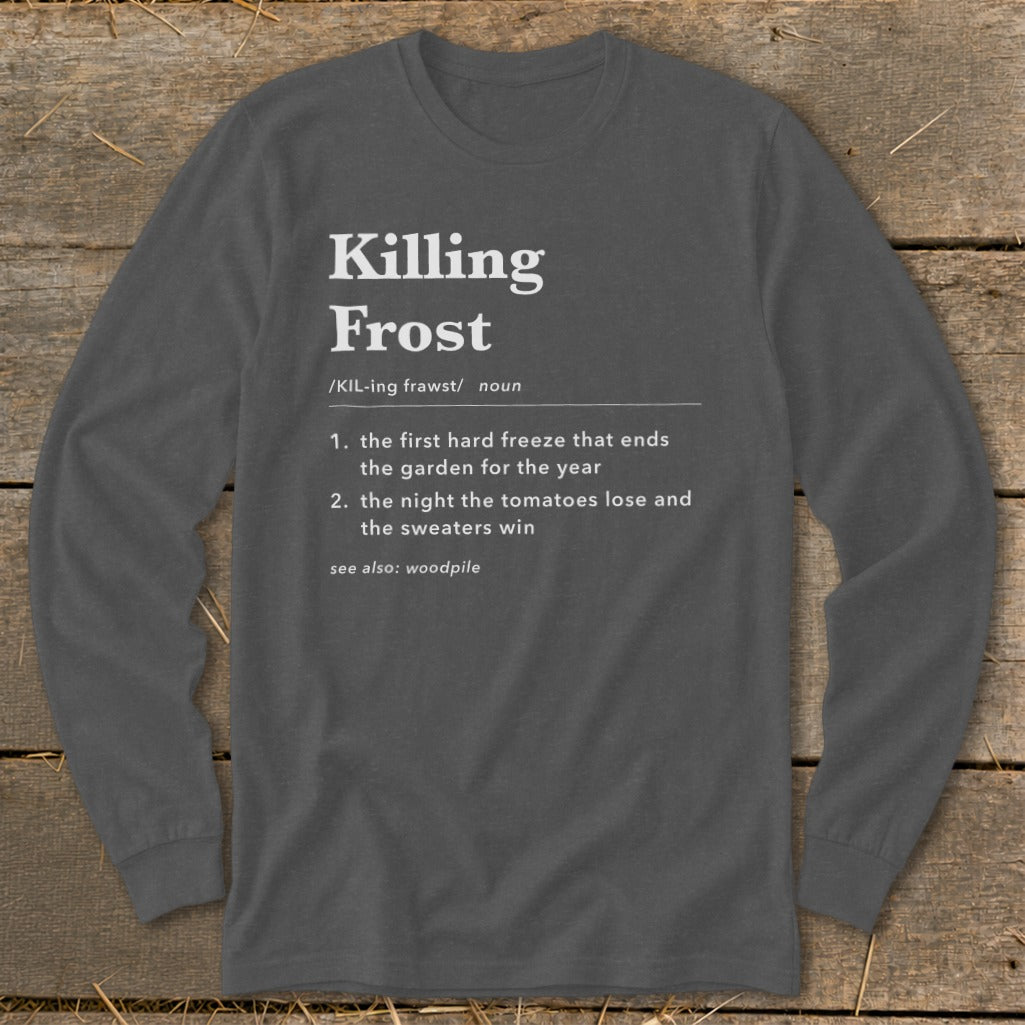Dark grey long-sleeve t-shirt with white dictionary-style text defining Killing Frost, laid flat on wooden planks.