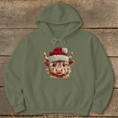 Olive green hoodie with a cartoon Highland cow wearing a Santa hat.