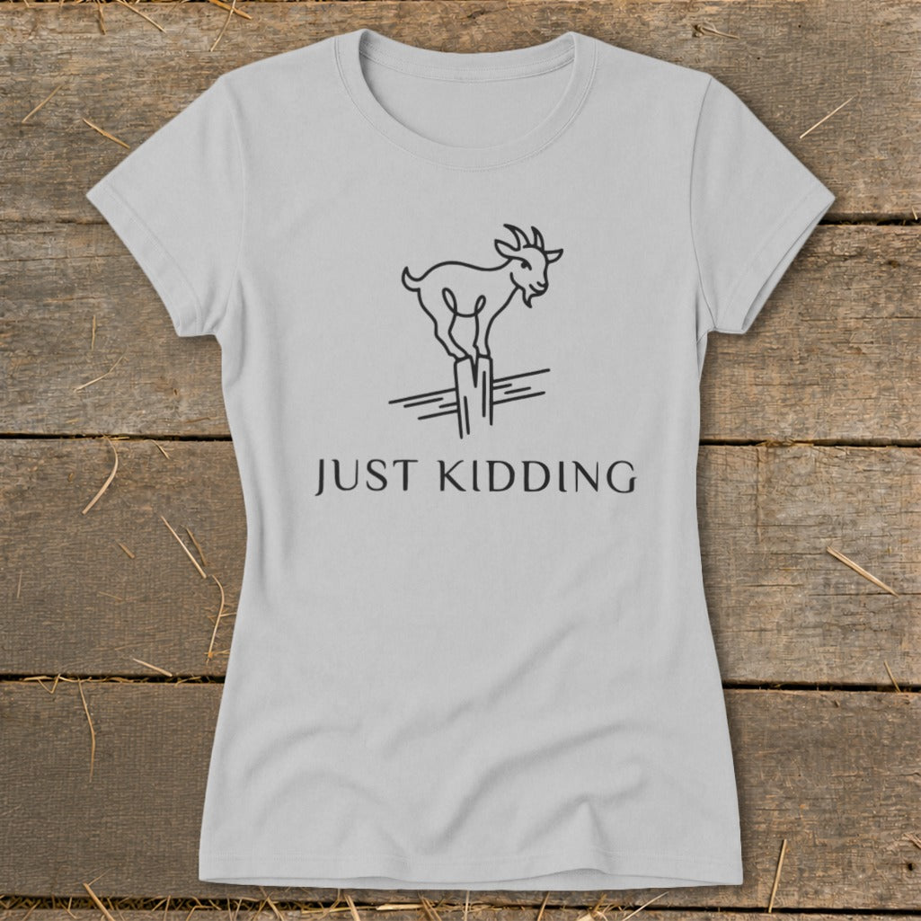 Light gray t-shirt with a minimalist goat balancing on a post, text reads "JUST KIDDING."