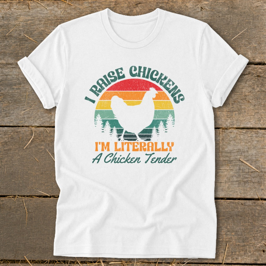 White t-shirt with a graphic reading "I Raise Chickens" and "I'm Literally A Chicken Tender".