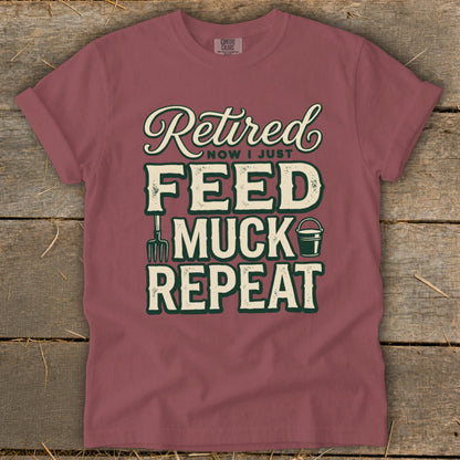 T-shirt with "Retired Now I Just Feed Muck Repeat" text and farm graphics.