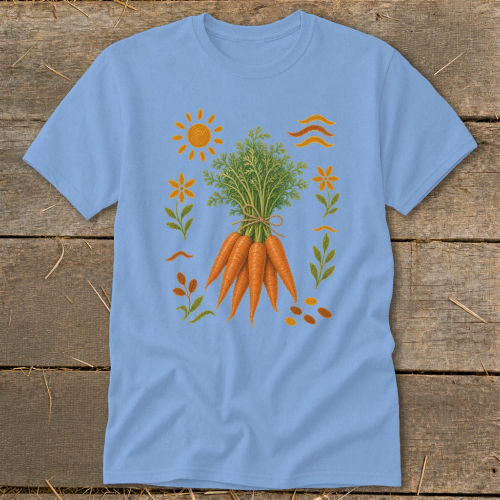 Light blue t-shirt with a graphic of a bunch of carrots surrounded by sun, flowers, and leaves.