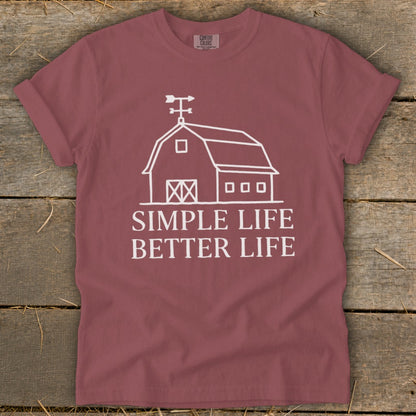 Maroon t-shirt with white barn graphic and text "Simple Life Better Life".