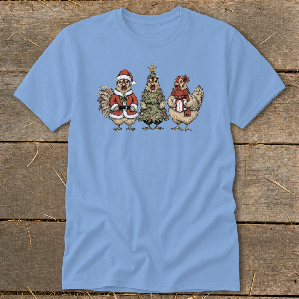 Light blue t-shirt with a graphic of a rooster in a Santa suit, a Christmas tree, and a hen holding a gift.