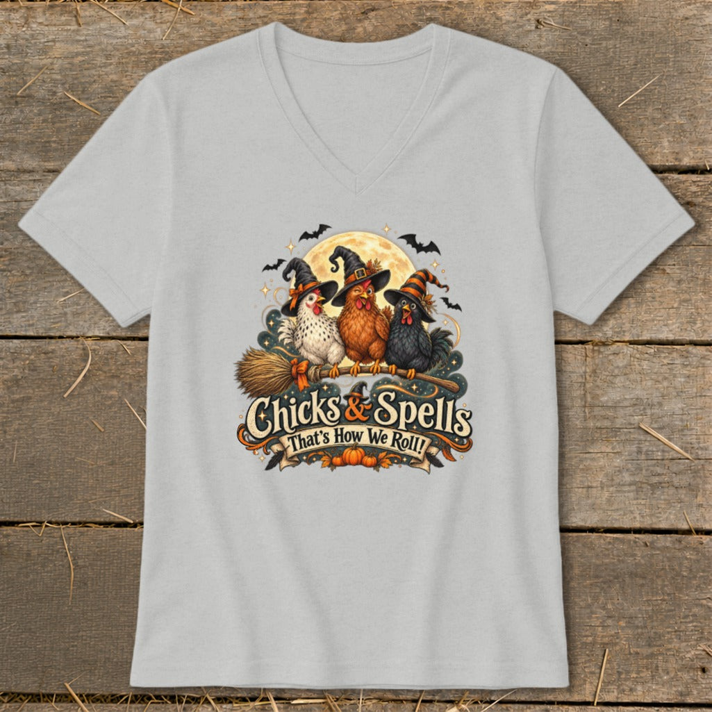 Three chickens in witch hats on a broomstick with text "Chicks & Spells".