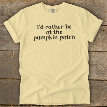 Yellow t-shirt with black text that reads "I'd rather be at the pumpkin patch".