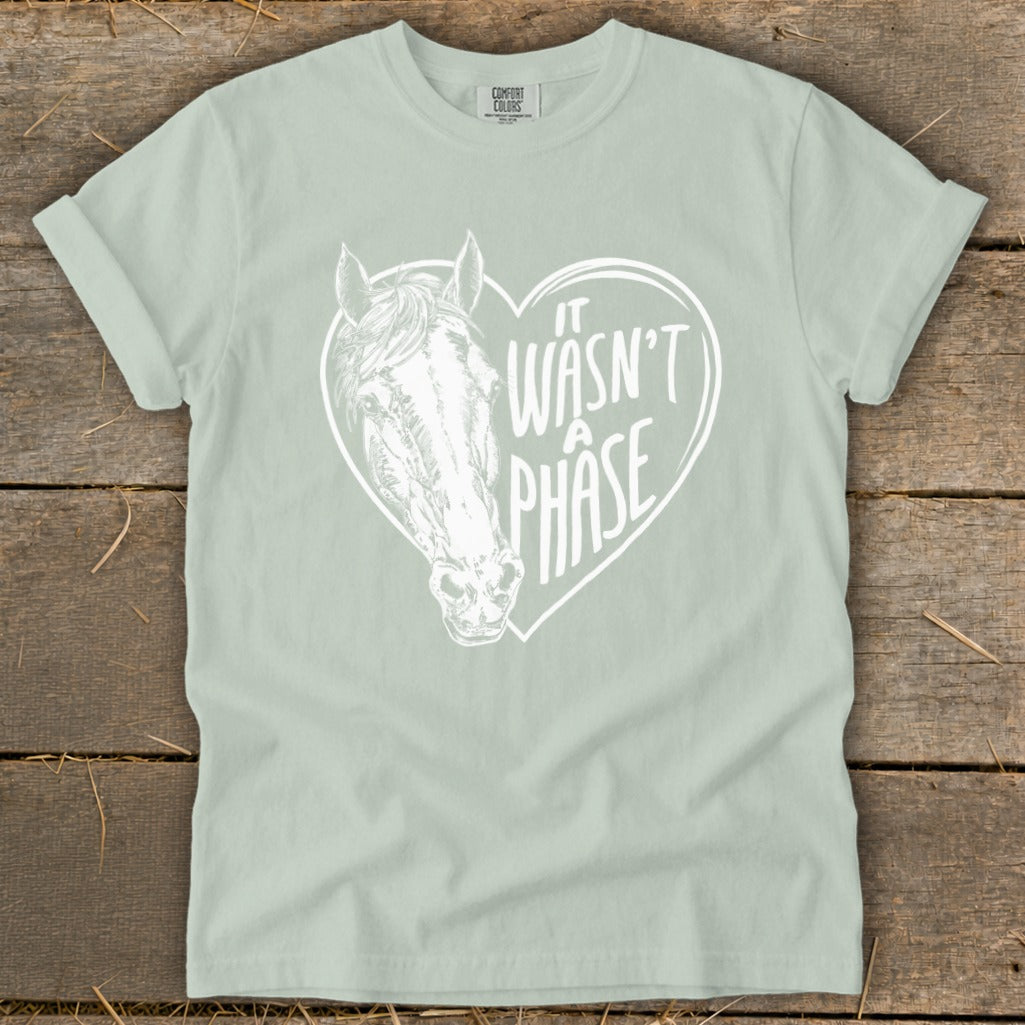Light green t-shirt with a white horse head inside a heart with text.