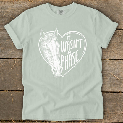 Light green t-shirt with a white horse head inside a heart with text.