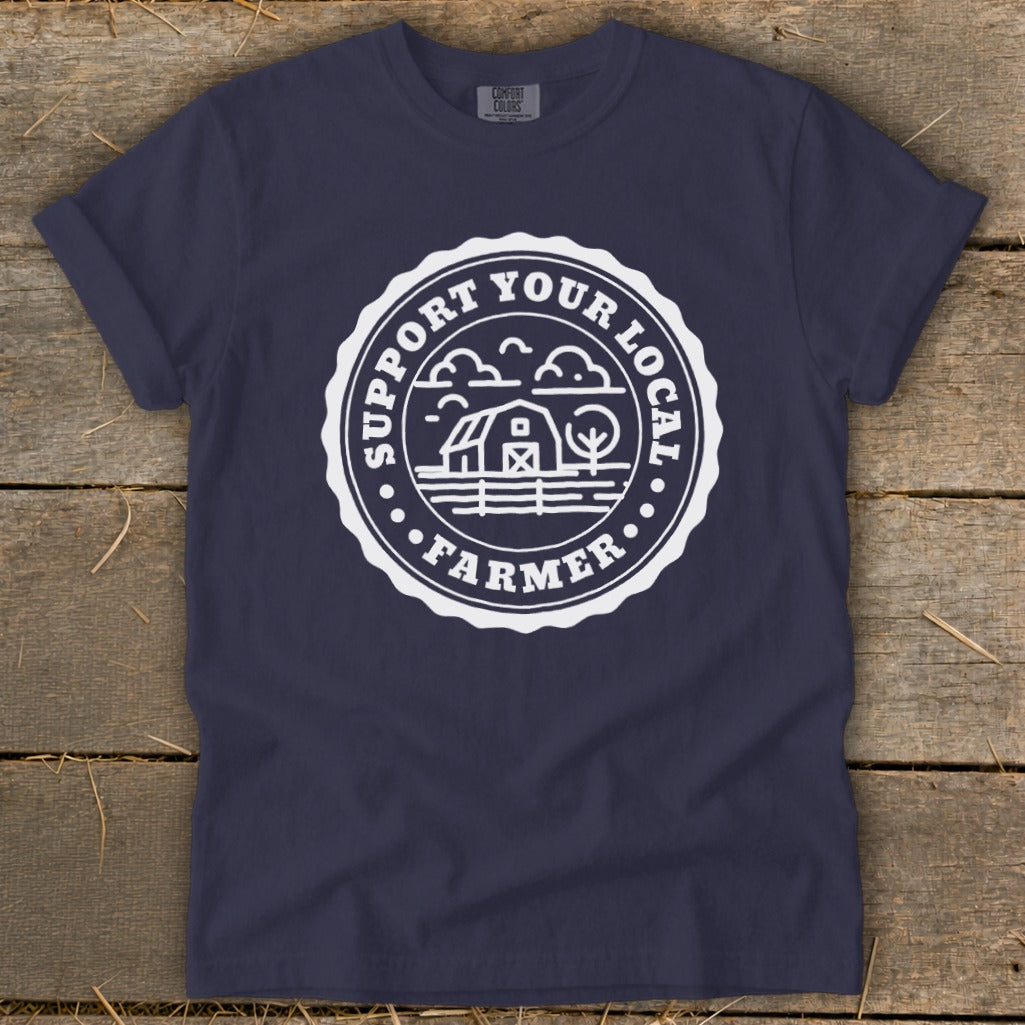Navy t-shirt with white circular graphic: "Support Your Local Farmer" and farm imagery.