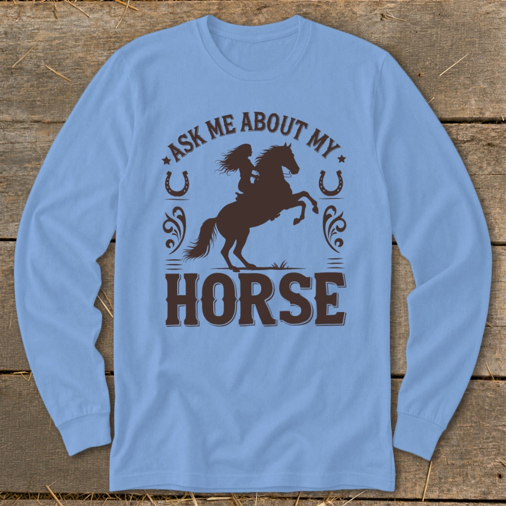 Light blue long-sleeve shirt with brown graphic "Ask Me About My Horse" and a rider on a rearing horse.