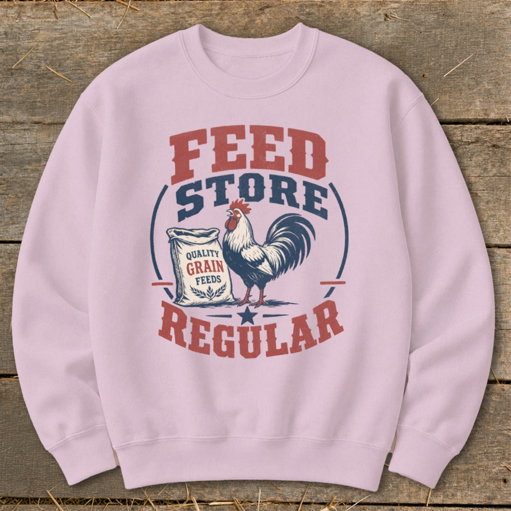 Light pink sweatshirt with vintage "Feed Store Regular" design and rooster graphic.