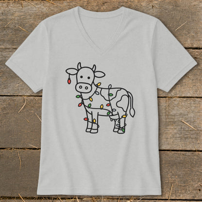 T-shirt featuring a line drawing of a cow decorated with colorful Christmas lights.