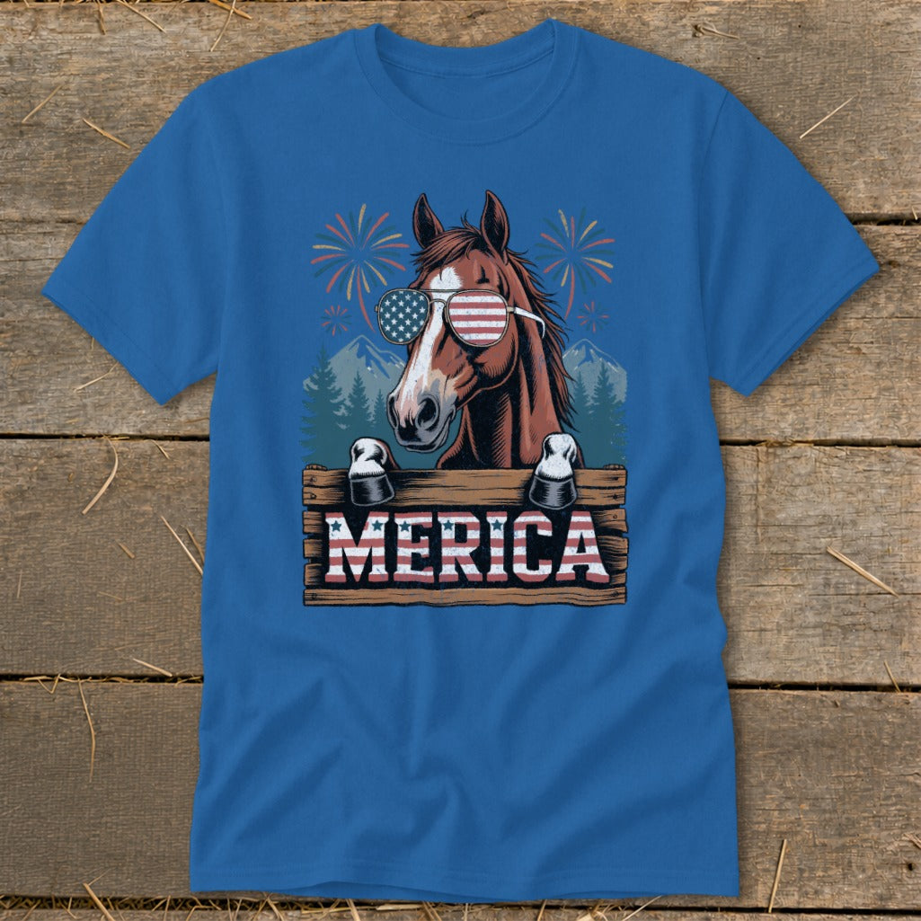 Brown horse wearing American flag sunglasses behind "MERICA" sign with fireworks.