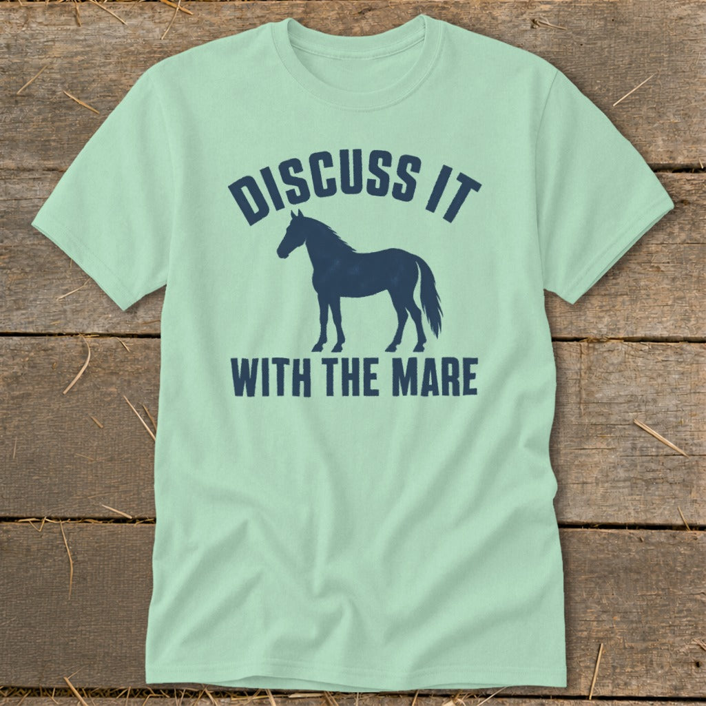 Light green t-shirt with navy blue horse silhouette and text "DISCUSS IT WITH THE MARE".