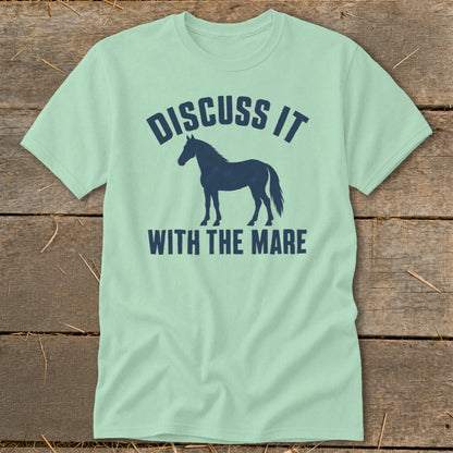 Light green t-shirt with navy blue horse silhouette and text "DISCUSS IT WITH THE MARE".