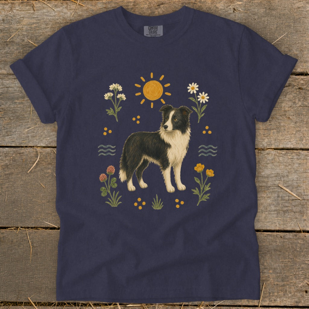 Navy t-shirt with a Border Collie surrounded by flowers, sun, and water motifs.
