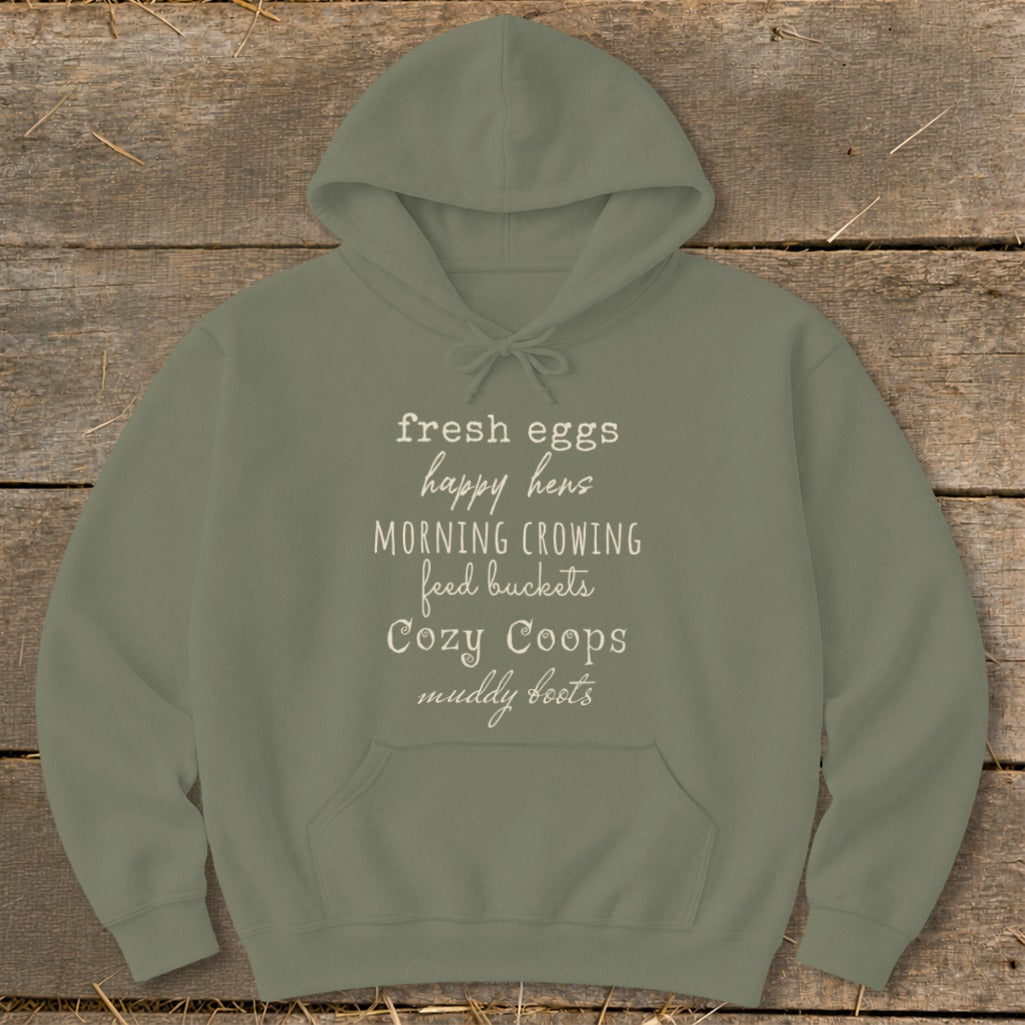 Olive green hoodie with white text listing farm-related phrases.