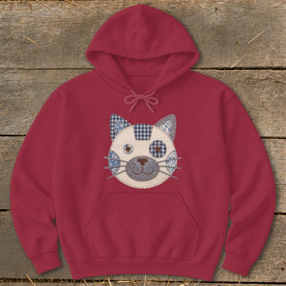 Maroon hoodie with a quilted cat face design on the front.