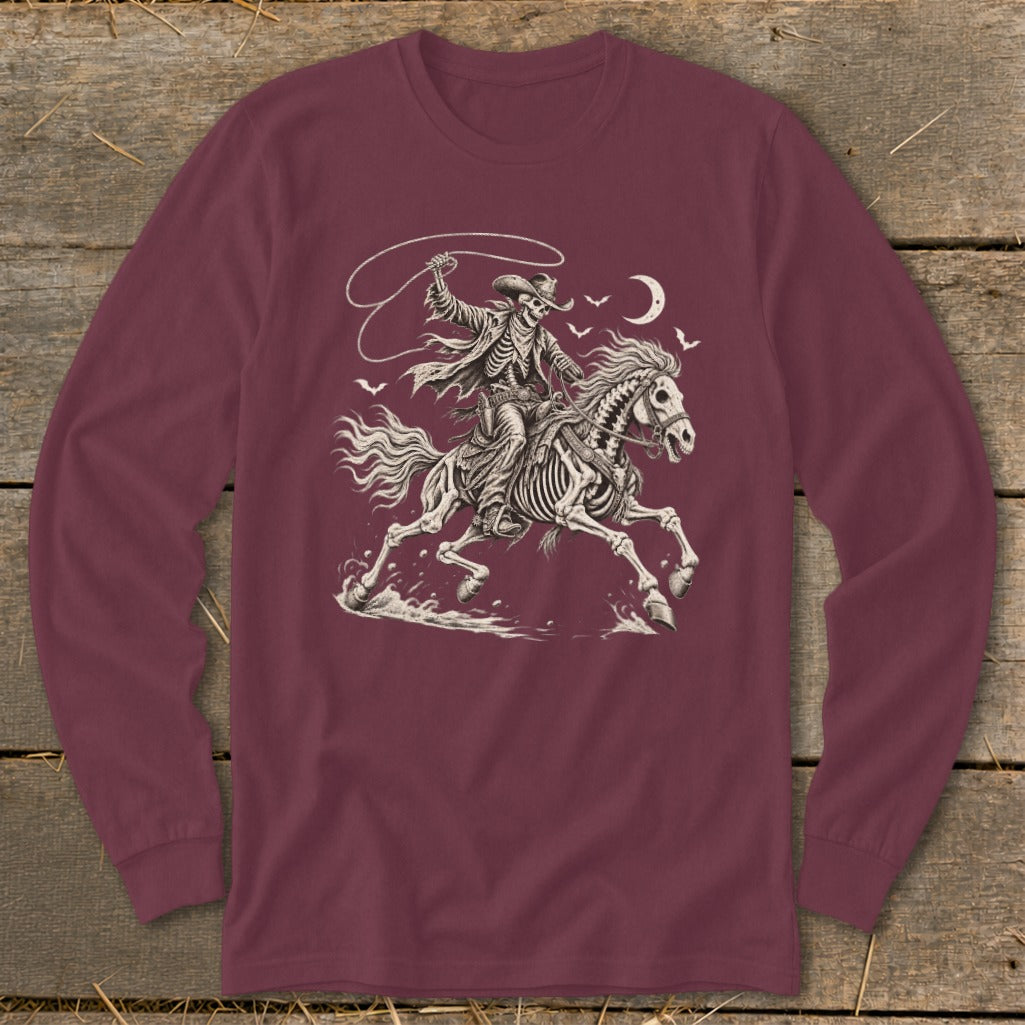 Skeleton cowboy on horseback with lasso, moon, and birds overhead.