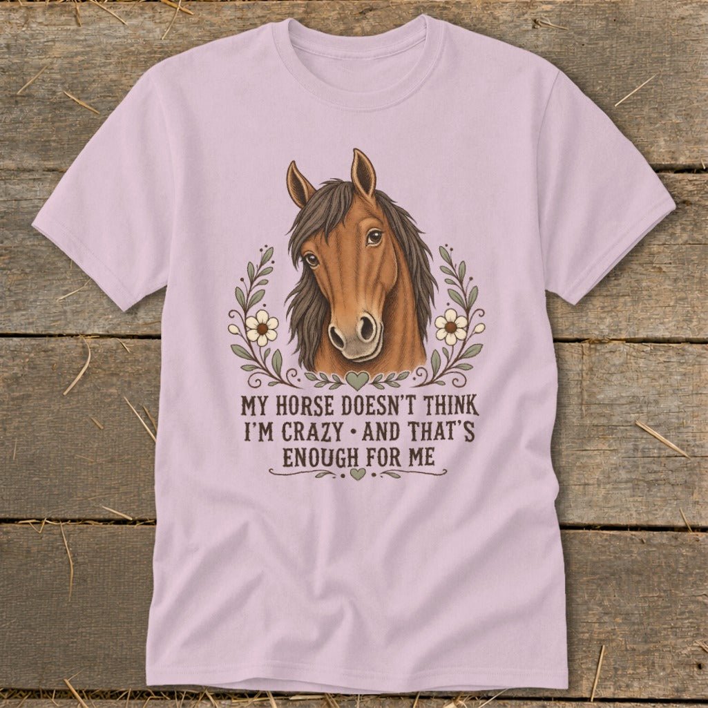 Light pink t-shirt with a horse illustration and text "MY HORSE DOESN'T THINK I'M CRAZY AND THAT'S ENOUGH FOR ME."