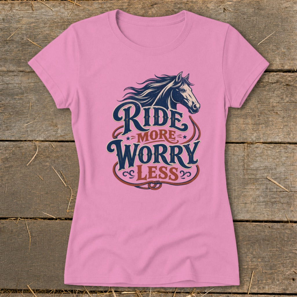 Pink t-shirt with horse graphic and text "Ride More Worry Less".