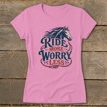 Pink t-shirt with horse graphic and text "Ride More Worry Less".