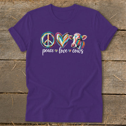 Purple t-shirt with colorful peace sign, heart, and cow graphic with "peace love cows" text.