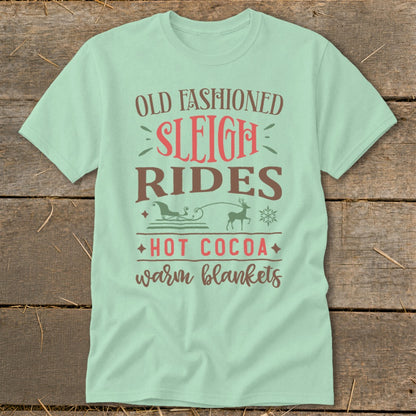 Pale green t-shirt with text Old Fashioned Sleigh Rides, Hot Cocoa, warm blankets.