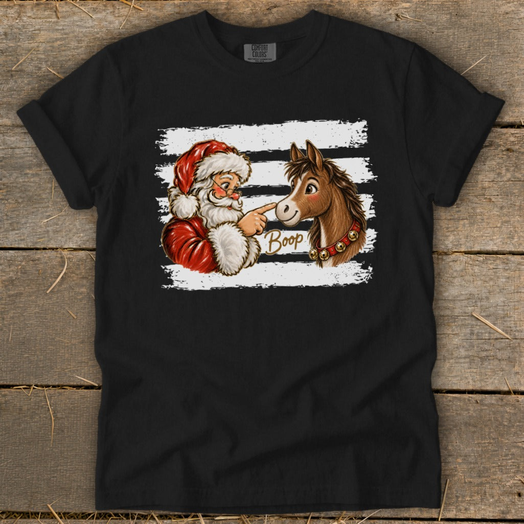 Santa booping a horse on the nose with the word "Boop" written on the shirt.