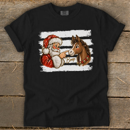 Santa booping a horse on the nose with the word "Boop" written on the shirt.