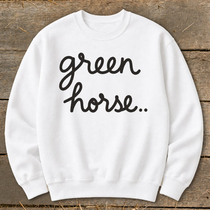 White sweatshirt with "green horse.." text in black cursive lettering.