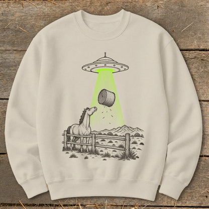 UFO beaming a hay bale away from a horse in a field.