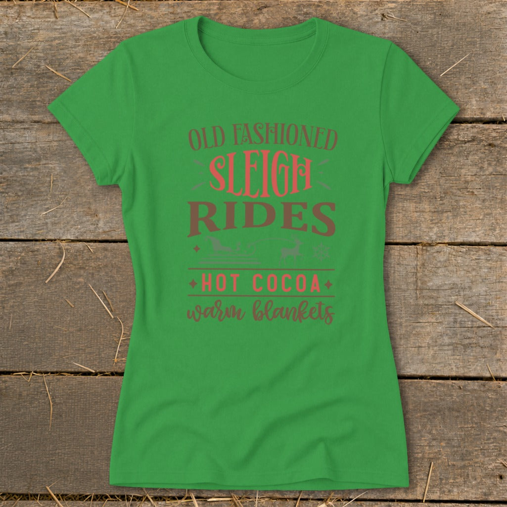 Green t-shirt with "Old Fashioned Sleigh Rides," "Hot Cocoa," and "warm blankets" text.