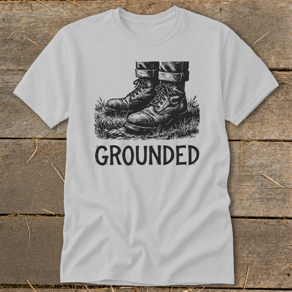 Light grey t-shirt with black graphic of boots and "GROUNDED" text.