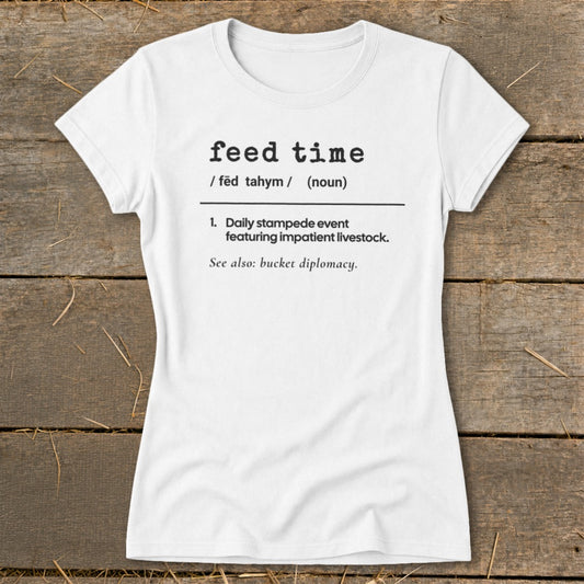 White t-shirt with black text defining "feed time" and its humorous description.
