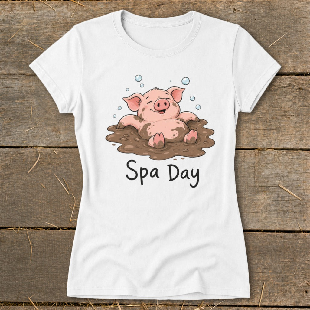 White t-shirt with a cartoon pig in mud, with bubbles and "Spa Day" text.