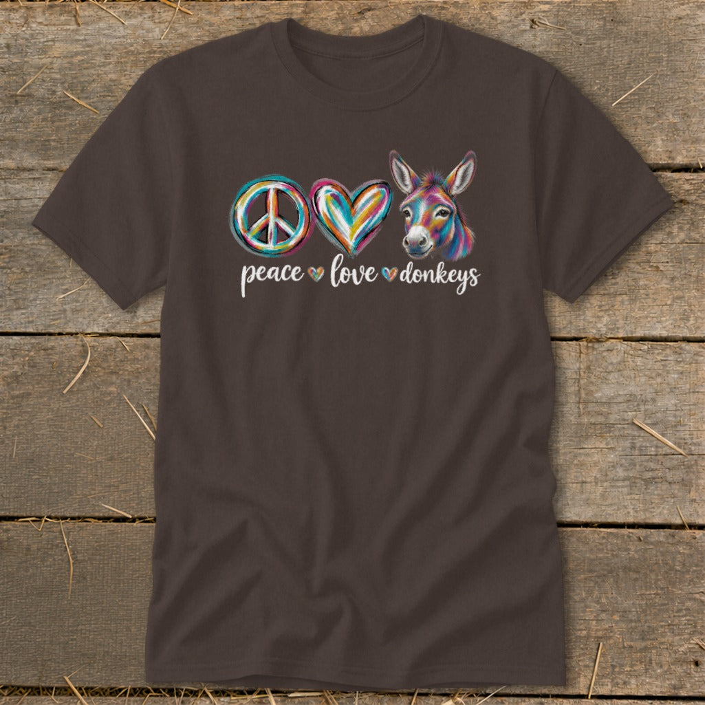 Brown t-shirt with peace sign, colorful heart, and donkey graphic reading "peace love donkeys".