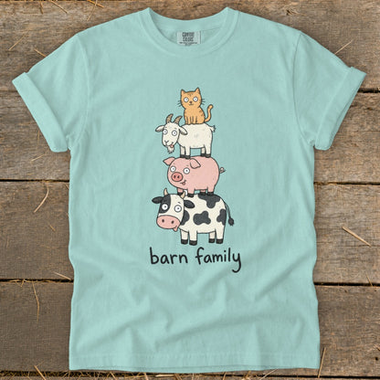 Light blue t-shirt with stacked cartoon cow, pig, goat, and cat graphic saying "barn family."
