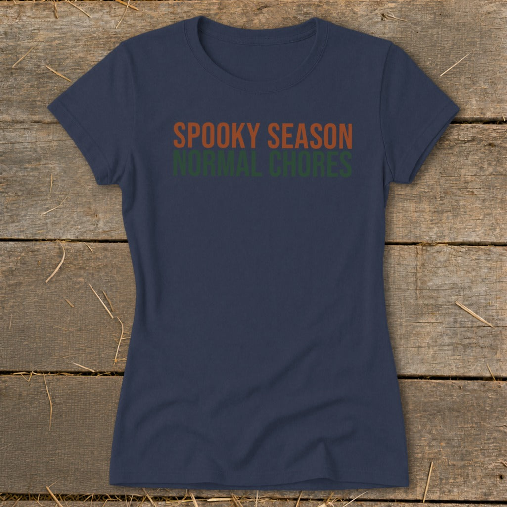 Navy t-shirt with orange text "SPOOKY SEASON" and green text "NORMAL CHORES".