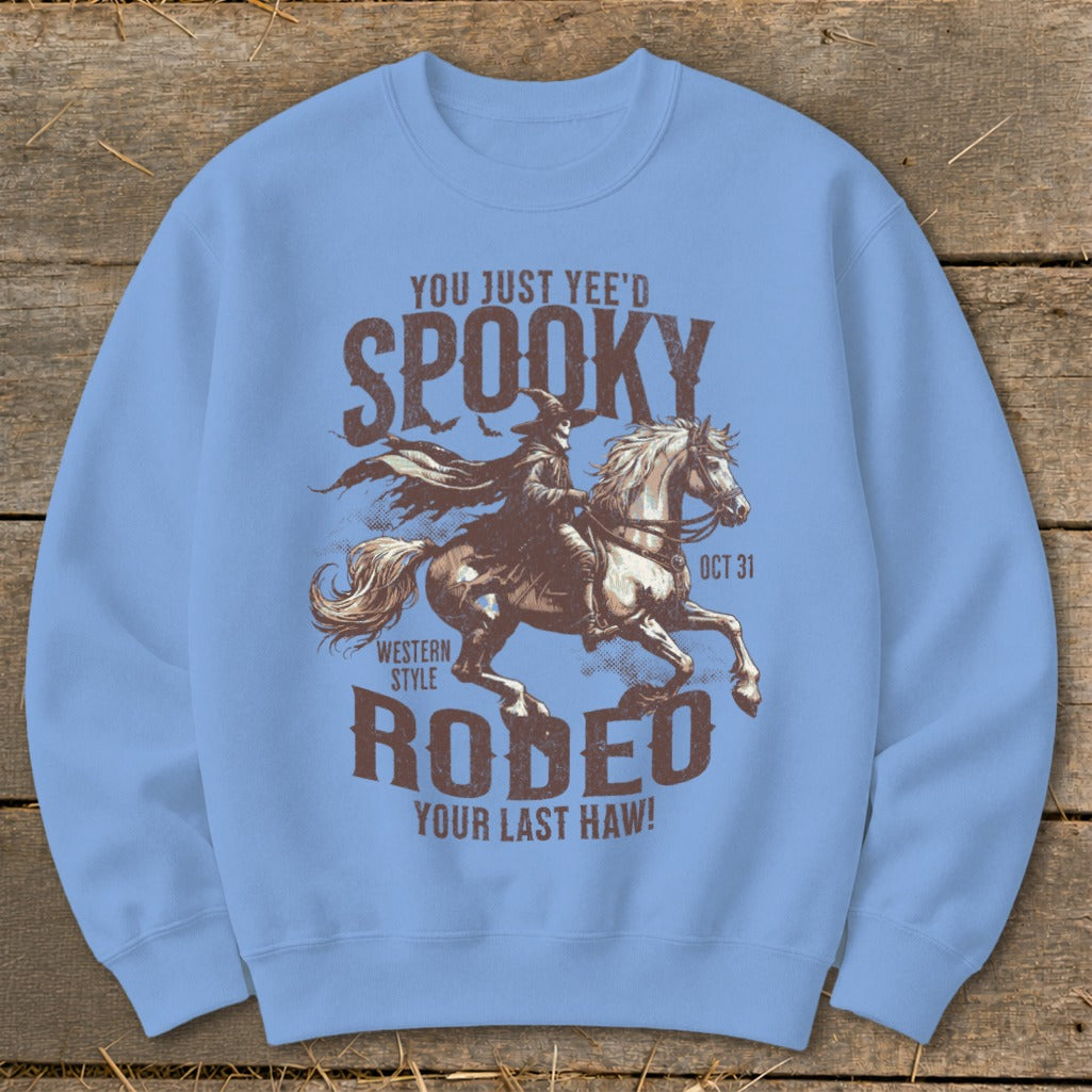 Light blue sweatshirt with a spooky Halloween rodeo graphic and text.