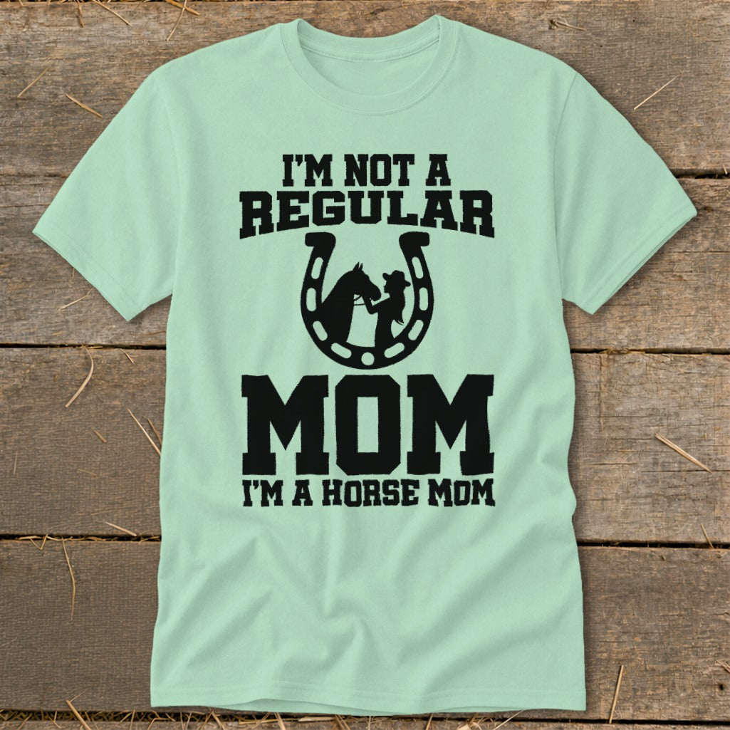 Light green t-shirt with black text: "I'M NOT A REGULAR MOM I'M A HORSE MOM"