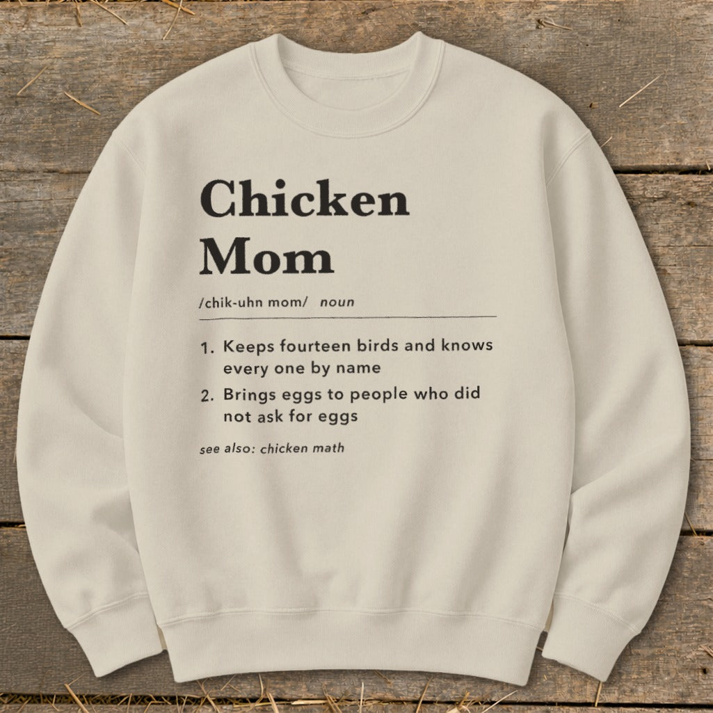 Cream sweatshirt with "Chicken Mom" definition printed in black text.