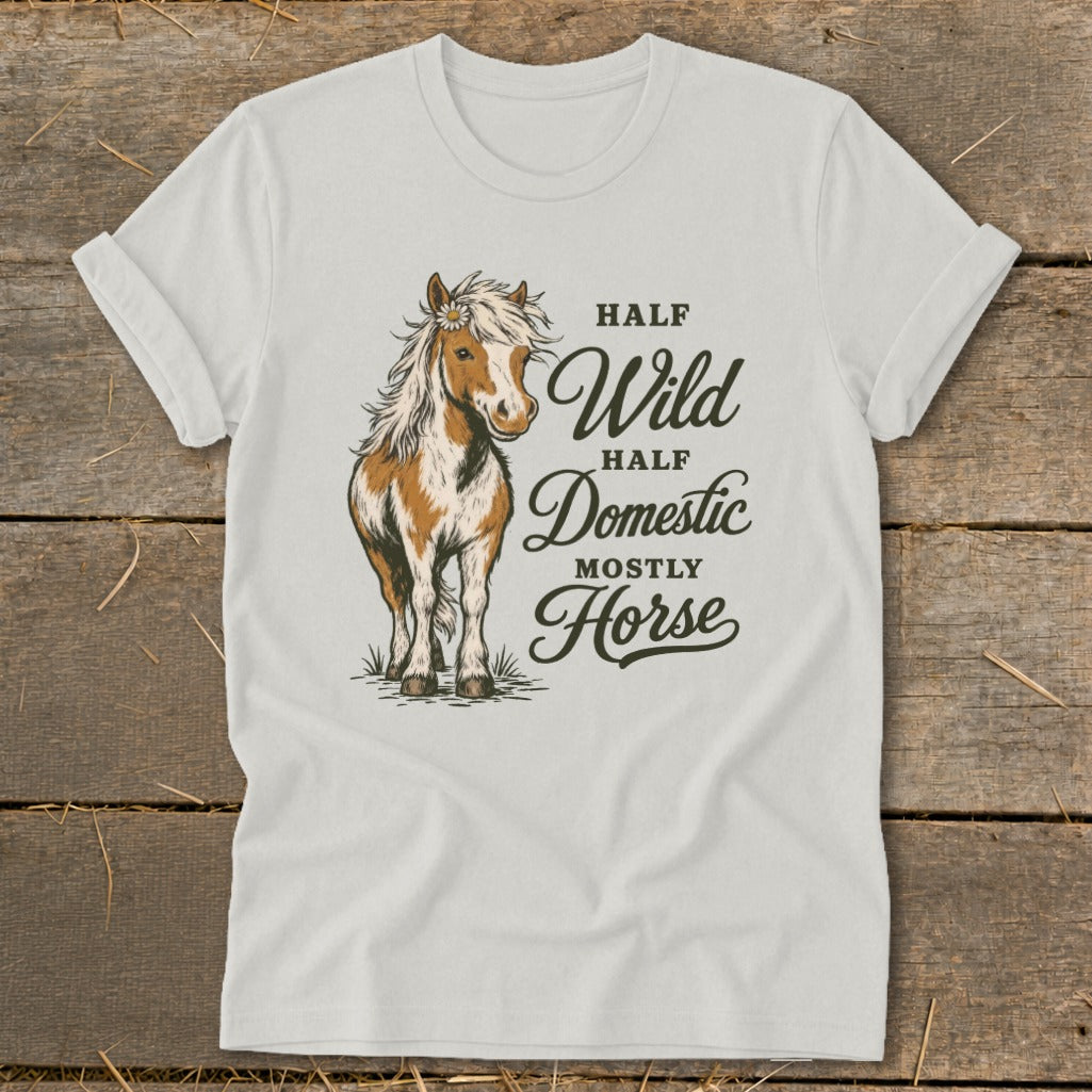 White t-shirt with illustration of a horse and text "Half Wild, Half Domestic, Mostly Horse".