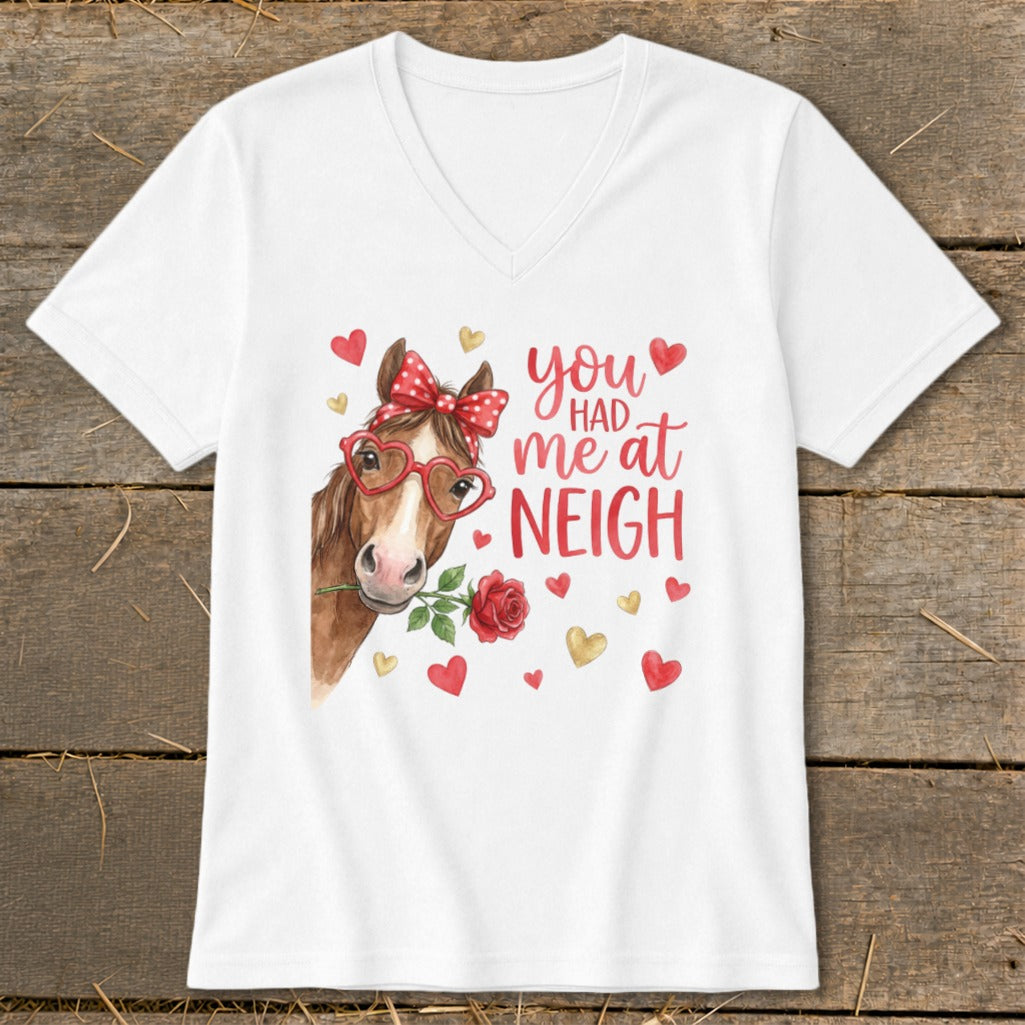 White t-shirt with a watercolor horse, red bow, heart glasses, and "you had me at neigh" text.