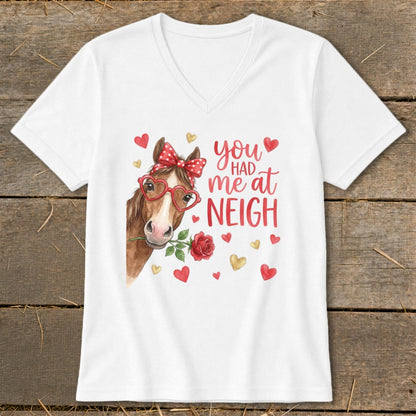 White t-shirt with a watercolor horse, red bow, heart glasses, and "you had me at neigh" text.