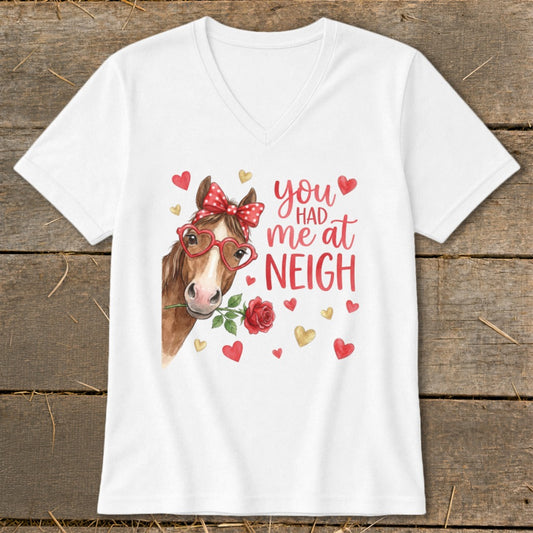White t-shirt with a watercolor horse, red bow, heart glasses, and "you had me at neigh" text.