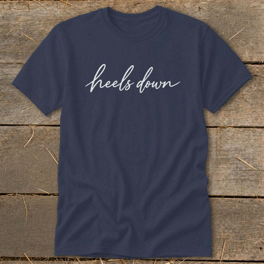 Navy t-shirt with white cursive text that reads "heels down".