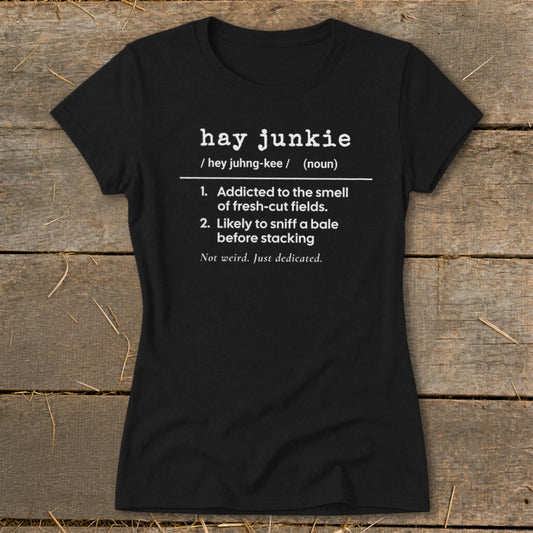 Black t-shirt with "hay junkie" definition: addicted to fresh-cut fields, sniffs bales.