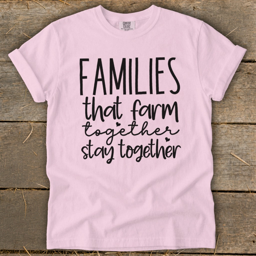 Pink t-shirt with black text reading "FAMILIES that farm together stay together".