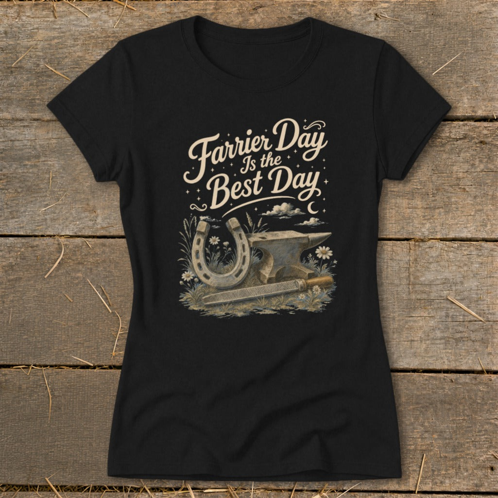 Black t-shirt with graphic "Farrier Day Is the Best Day" and anvil, horseshoe, file, and flowers.